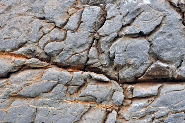 Oberflächenstruktur aus Kalkstein mit Rissen — Stockfoto