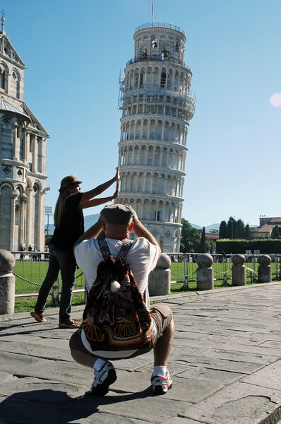 Tourists posing near the Leaning Tower, Pisa, Italy