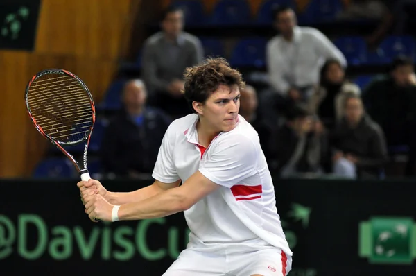 Thomas Kromann in action at a Davis Cup match, Romania wins against Denmark Denmark with 2:0. — Stock Photo, Image