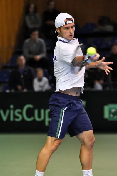 Tennis man Adrian Ungur in action at a Davis Cup match, Romania wins against Denmark — Stock Photo, Image