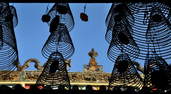 Silhouette of hanging incense coils in a Buddhist temple, pagoda. Vietnam — Stock Photo, Image