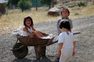Kurdish children playing in the village clipart