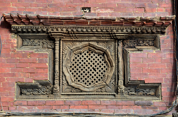 Carved wooden window on the Royal Palace. Patan, Nepal