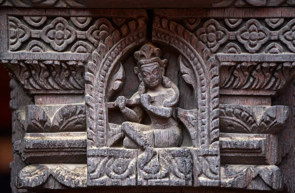 Carved wooden details on a Nepalese temple door — Stock Photo, Image