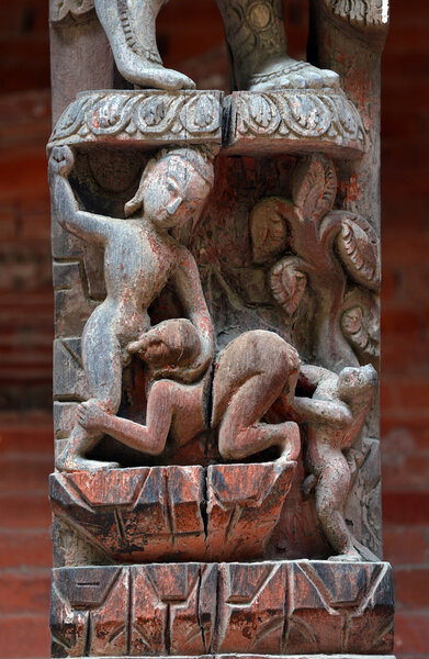 Erotic carving, explicit Kama Sutra position on a Nepalese temple in Patan, Kathmandu, Nepal