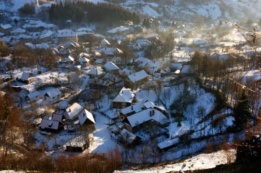 Rosia Montana village at wintertime. Romania clipart