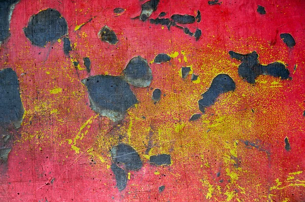 Red and yellow rusty, scratched metal background — Stock Photo, Image