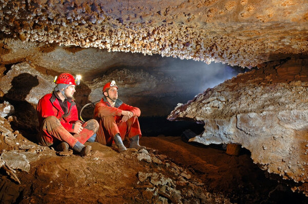 Two spelunkers in a cave