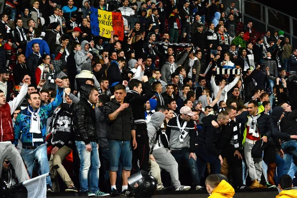 Soccer fans in a stadium — Stock Photo, Image