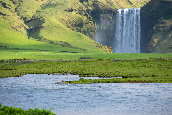 Skogafoss waterfall, on the Ring Road in Southern Iceland, is one of country's most epic tourist destinations