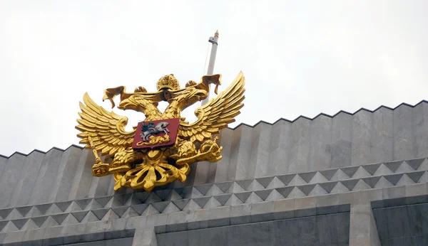 Russia coat of arms, golden eagle, on the top of the roof