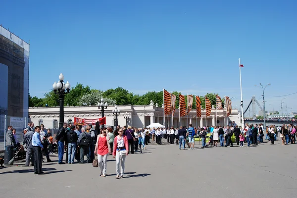 People walk to the Gorky park to celebrate Victory Day.