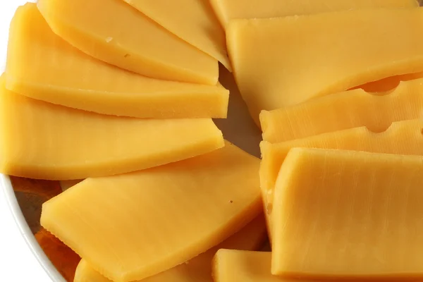 Sliced cheese on a plate — Stock Photo, Image