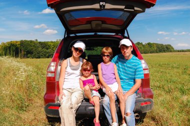 Family car trip on summer vacation clipart