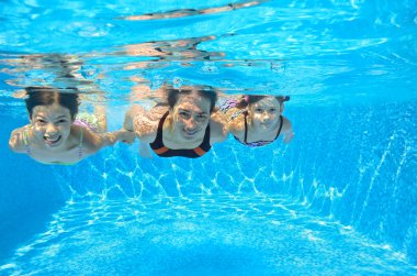 Happy family swim underwater in pool clipart
