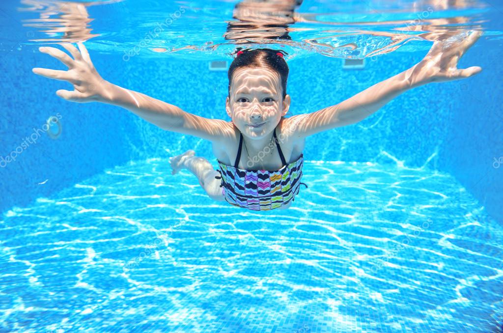 Happy active underwater child swims in pool Stock Photo by ©JaySi 50139529