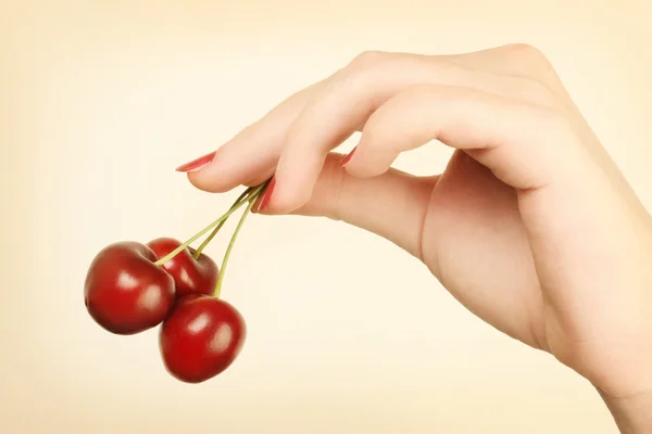Hand with cherry