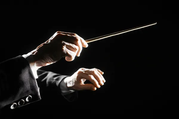 Orchestra conductor hands baton — Stock Photo, Image