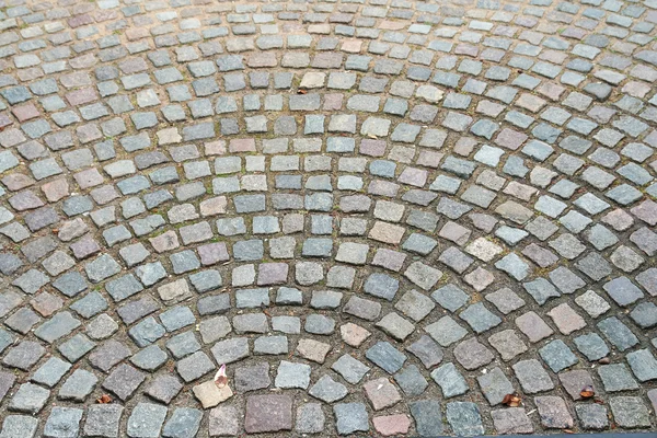 Old cobbled stones road background — Stock Photo, Image