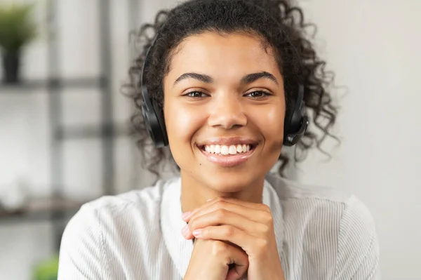 Biracial young woman with Afro hair wearing headset — Stock Photo, Image