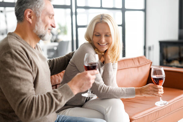 Happy senior couple having fun at home, enjoying time together at home