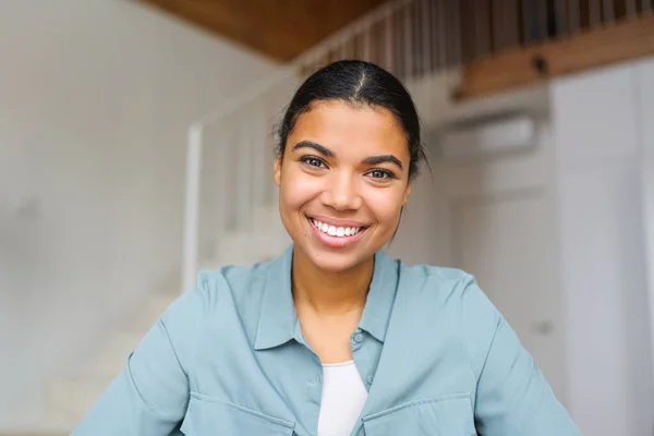Close-up portrait of happy young woman looking at the camera and smiling. Concept of video call, online communication on the laptop. Webcam view — Stockfoto