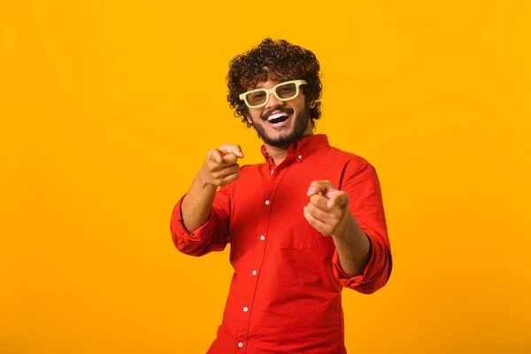 Hey you. Portrait of cheerful bearded man pointing to camera, smiling, making happy choice, we need you concept. Indoor studio shot isolated on orange — 图库照片