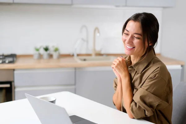 Glad to meet you. Happy young Asian multiracial woman sitting at the desk at home office — 스톡 사진