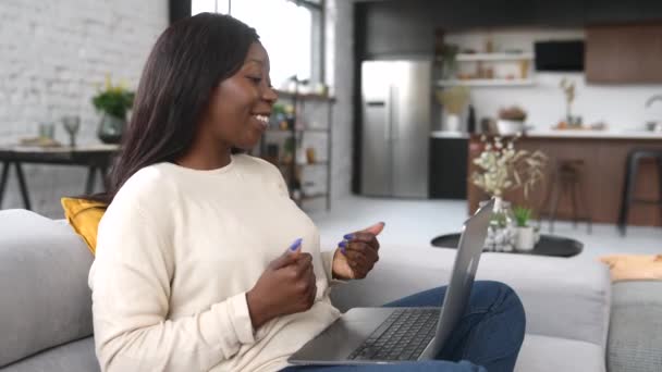 Multiracial young woman is using laptop for video call — Stock Video