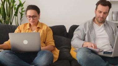 Father and mother working on the distance during quarantine