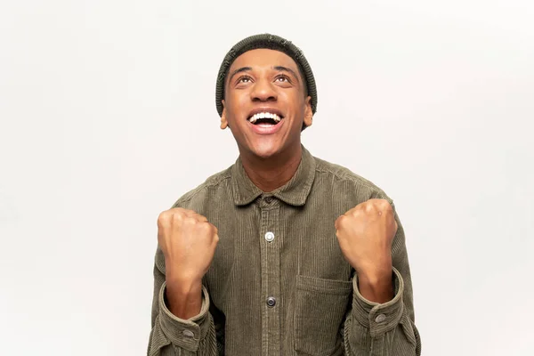 Extremely excited overjoyed man shouting making yes gesture, amazed with his victory, triumph. Indoor studio shot isolated on white — Photo