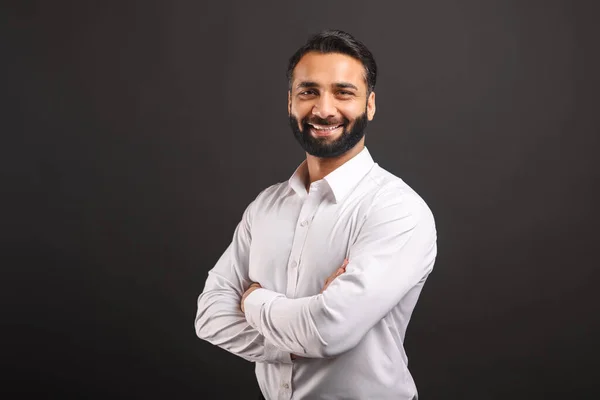 Proud Indian male businessman in white smart casual shirt stand with arms crossed — Zdjęcie stockowe
