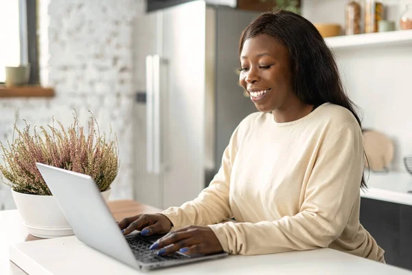 African-American female using computer for work online remotely, received emails —  Fotos de Stock