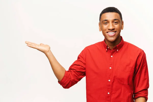 Handsome African American Young Man Red Shirt Points Palms Aside — Fotografia de Stock