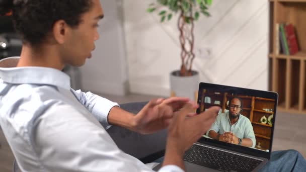 Virtual Conference Webinar Young Multiracial Man Waves Hello His Colleague — Vídeos de Stock