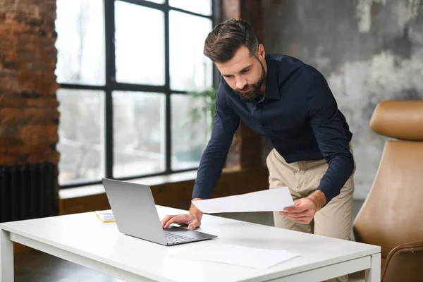 Busy Businessman Looking Workpaper Using Laptop Modern Loft Office Hurrying — Stockfoto