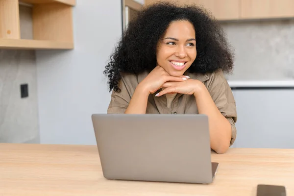 Portrait Young Multiracial Woman Sitting Desk Laptop Looking Away While — Φωτογραφία Αρχείου