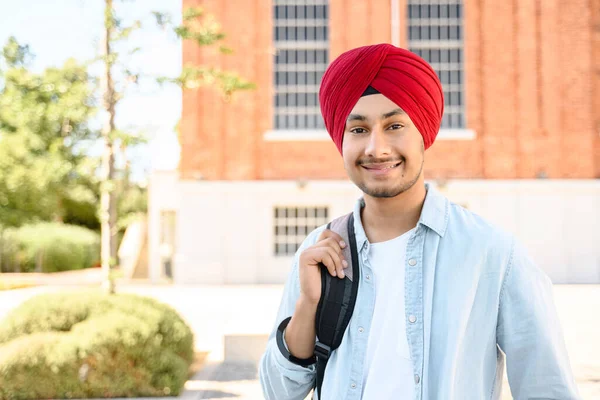 Carefree Happy Indian Male Student Backpack University Building Background Hindu — Φωτογραφία Αρχείου