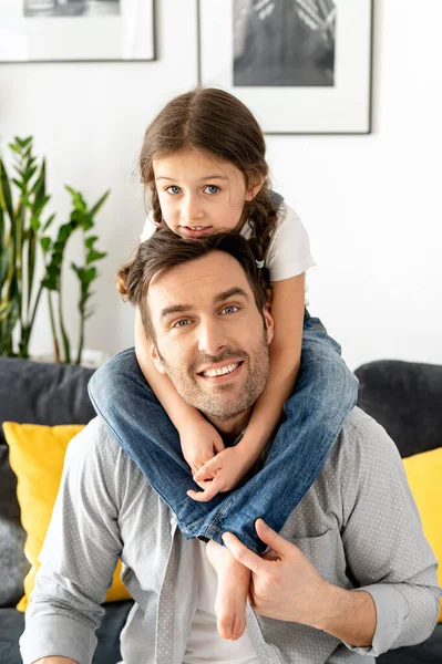 Loving Father Carrying His Little Toddler Daughter Shoulders Sitting Sofa — 图库照片