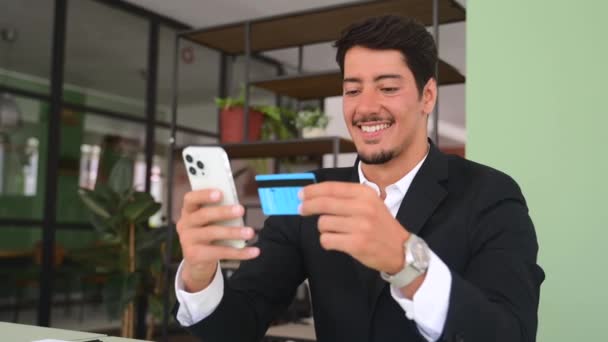Cheerful Latin Man Makes Purchase Online Hispanic Guy Business Wear — Vídeo de stock