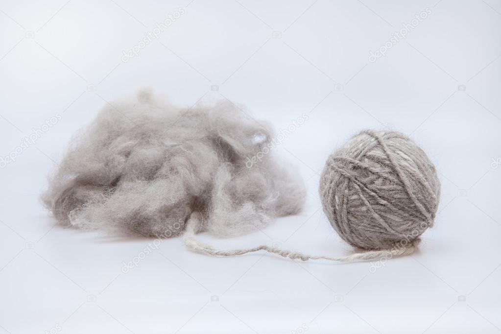 Raw wool yarn coiled into a ball