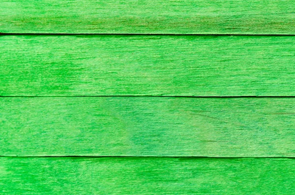 Vivid Green Wooden Texture Background. Green wooden planks arranged horizontally. Textured painted wood boards. Bright wooden background.