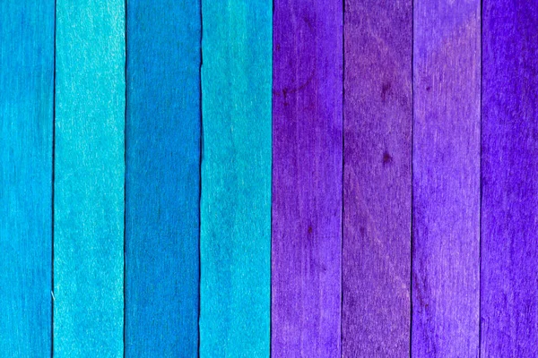 Two-tones Wooden textured background. Colored Wooden Planks in Blue and Purple arranged vertically and divided into two parts by colors.
