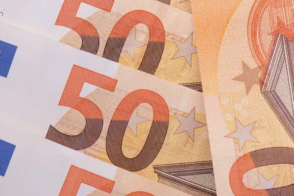 European currency paper money Fifty euros closeup. Financial, savings and money exchange concept. Fifty euro bills background. Money backdrop. Euro banknotes macro shot.