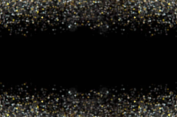 Black background with gold and silver sparkles. Stylish festive dark background copy space and glowing bokeh. Gold glitter defocused abstract Twinkly Lights Background. Golden bokeh frame.