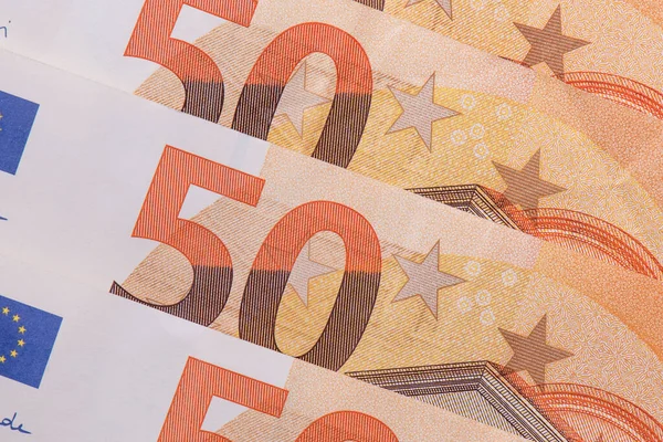Euro banknotes macro shot. European currency paper money Fifty euros closeup. Financial, savings and money exchange concept. Fifty euro bills background. Money background.