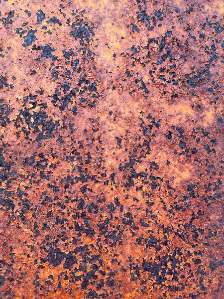 Rusty Texture. Dark worn textured metal surface close up. Industrial weathered metal background.