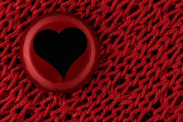 black heart on red texture