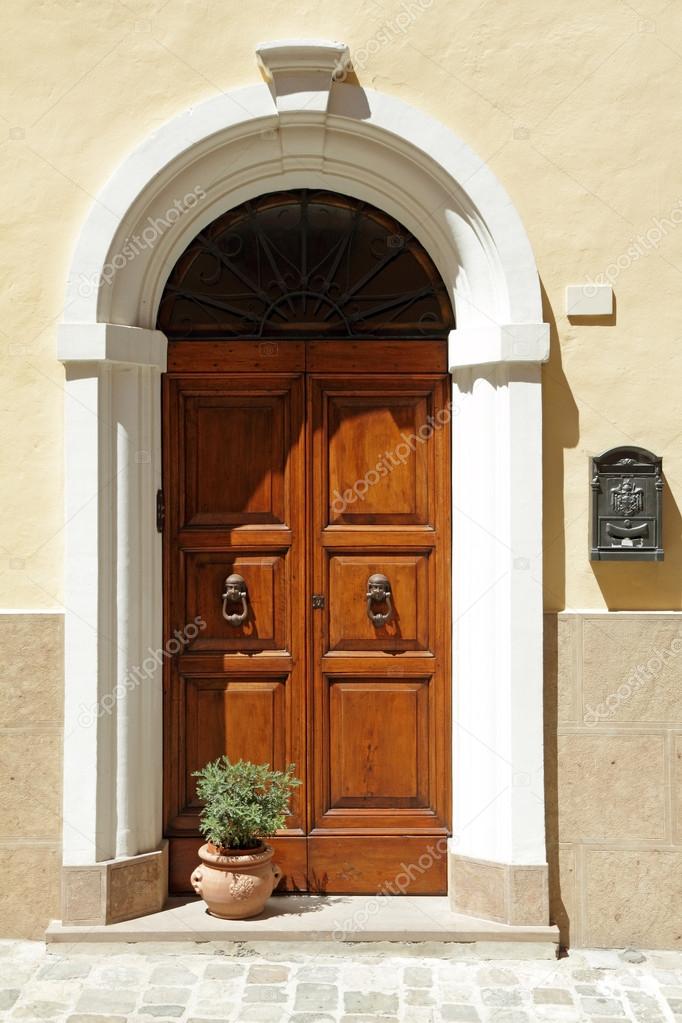 Elegant door framed with arc