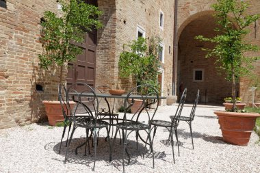 Garden furniture on italian backyard clipart